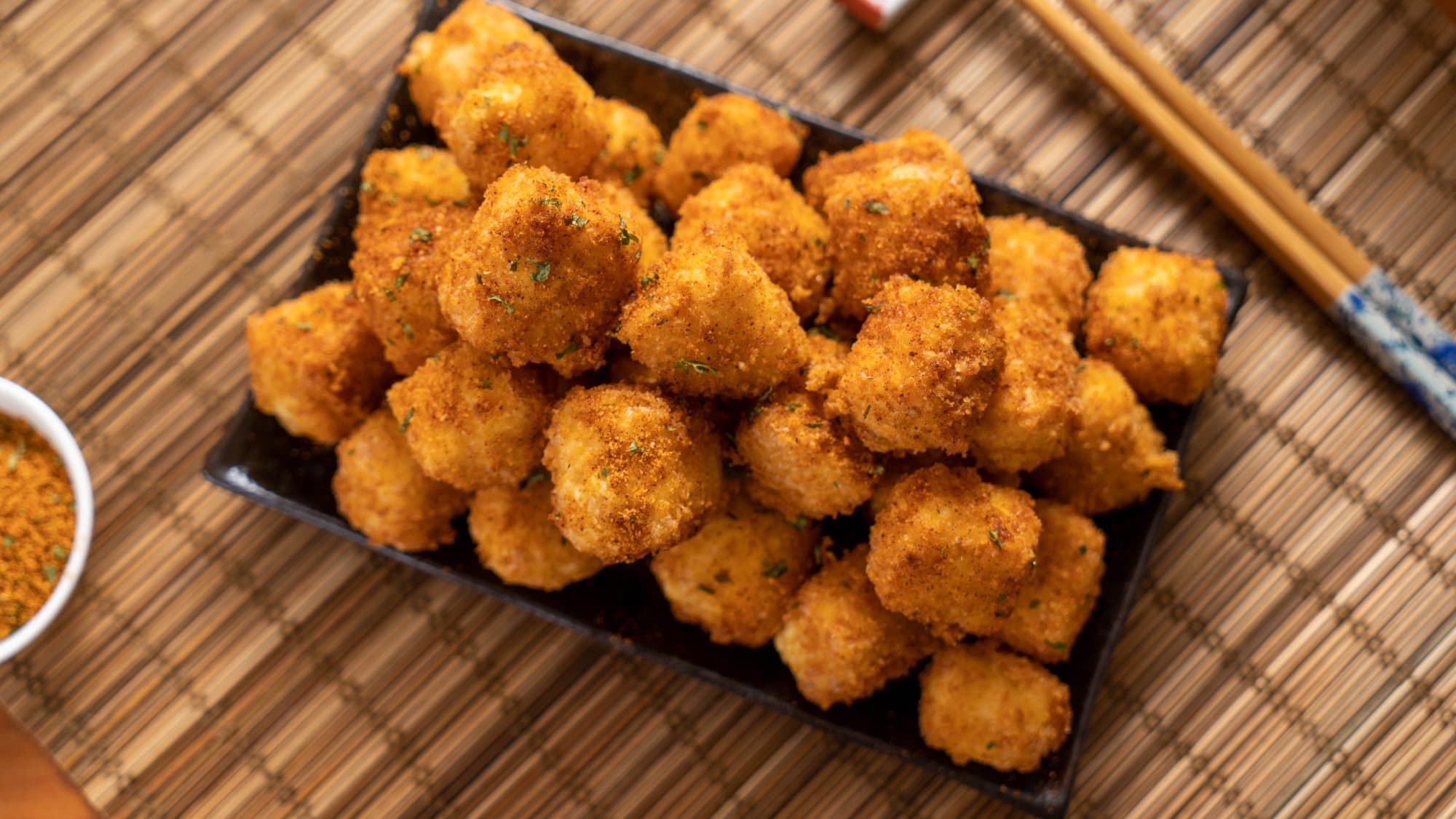 Golden Crispy Tofu - Crispy Fried tofu cubes with a golden exterior and a soft interior. Served as bi | Vegetable & Tofu