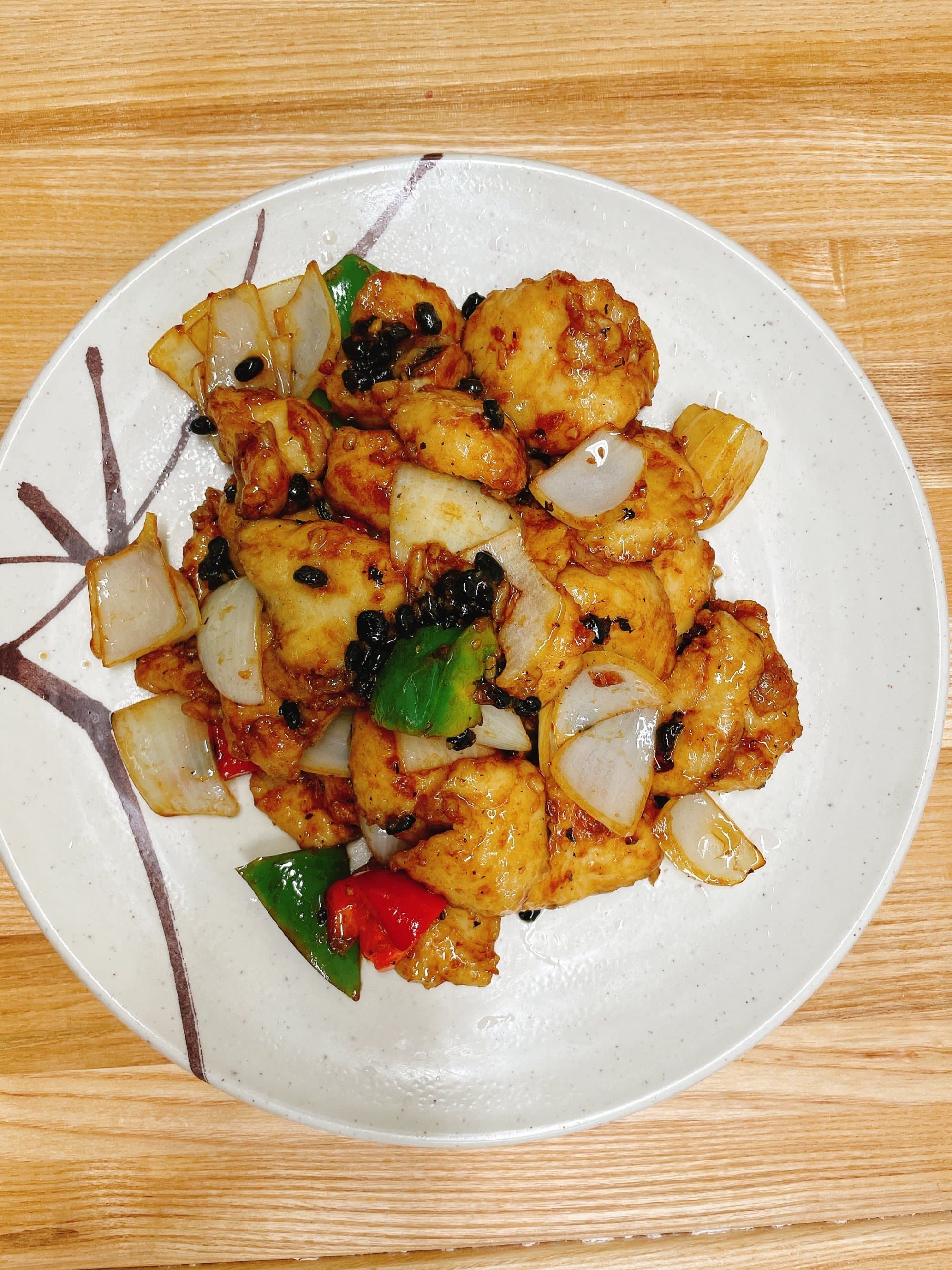 Fish Filet with Black Bean Sauce - Tender fish fillets cooked in a savory black bean sauce with a hint of garlic. T | Seafood